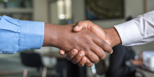 close up image of 2 people shaking hands